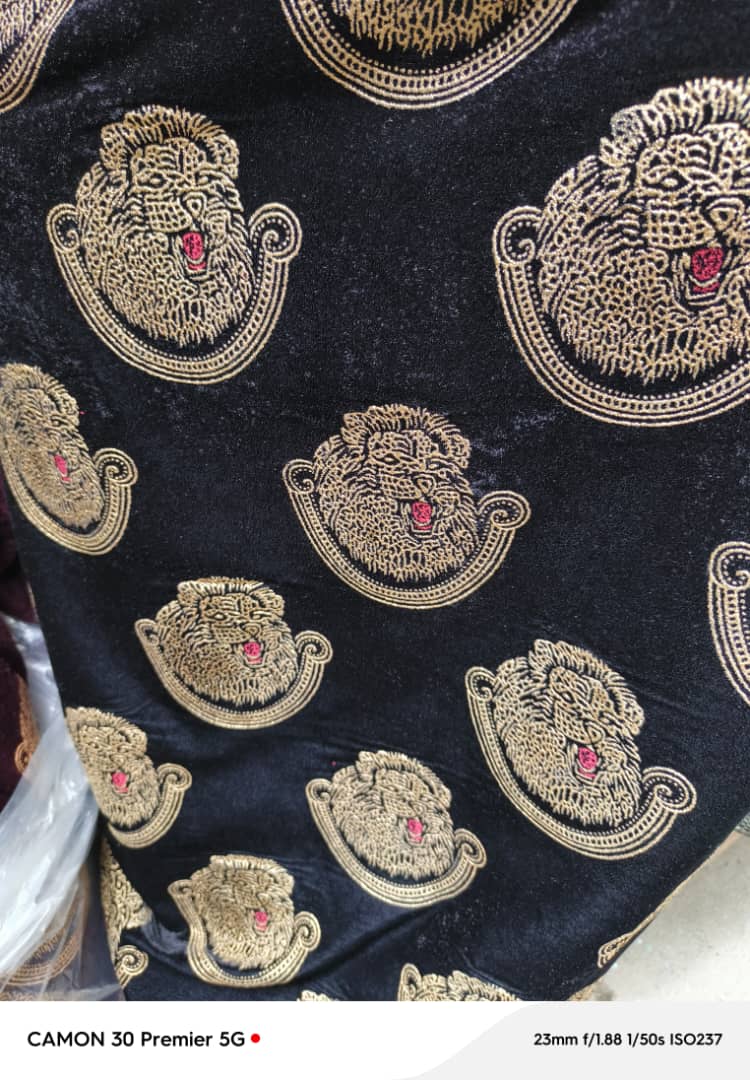 Black Isi-Agu with golden embroidery. price/yard